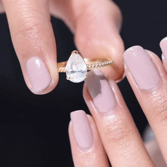 Pear Shaped Moissanite Solitaire Ring with Gold Twisted Rope