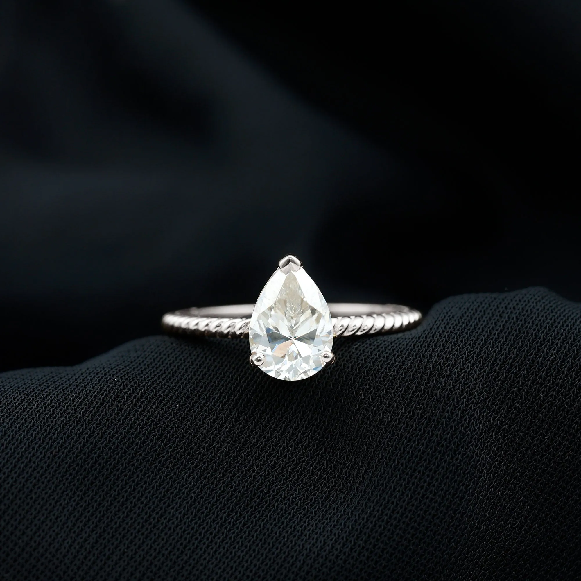 Pear Shaped Moissanite Solitaire Ring with Gold Twisted Rope