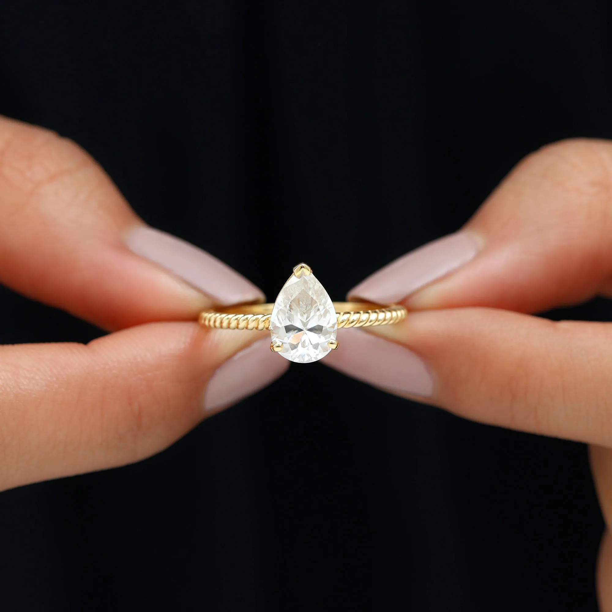 Pear Shaped Moissanite Solitaire Ring with Gold Twisted Rope