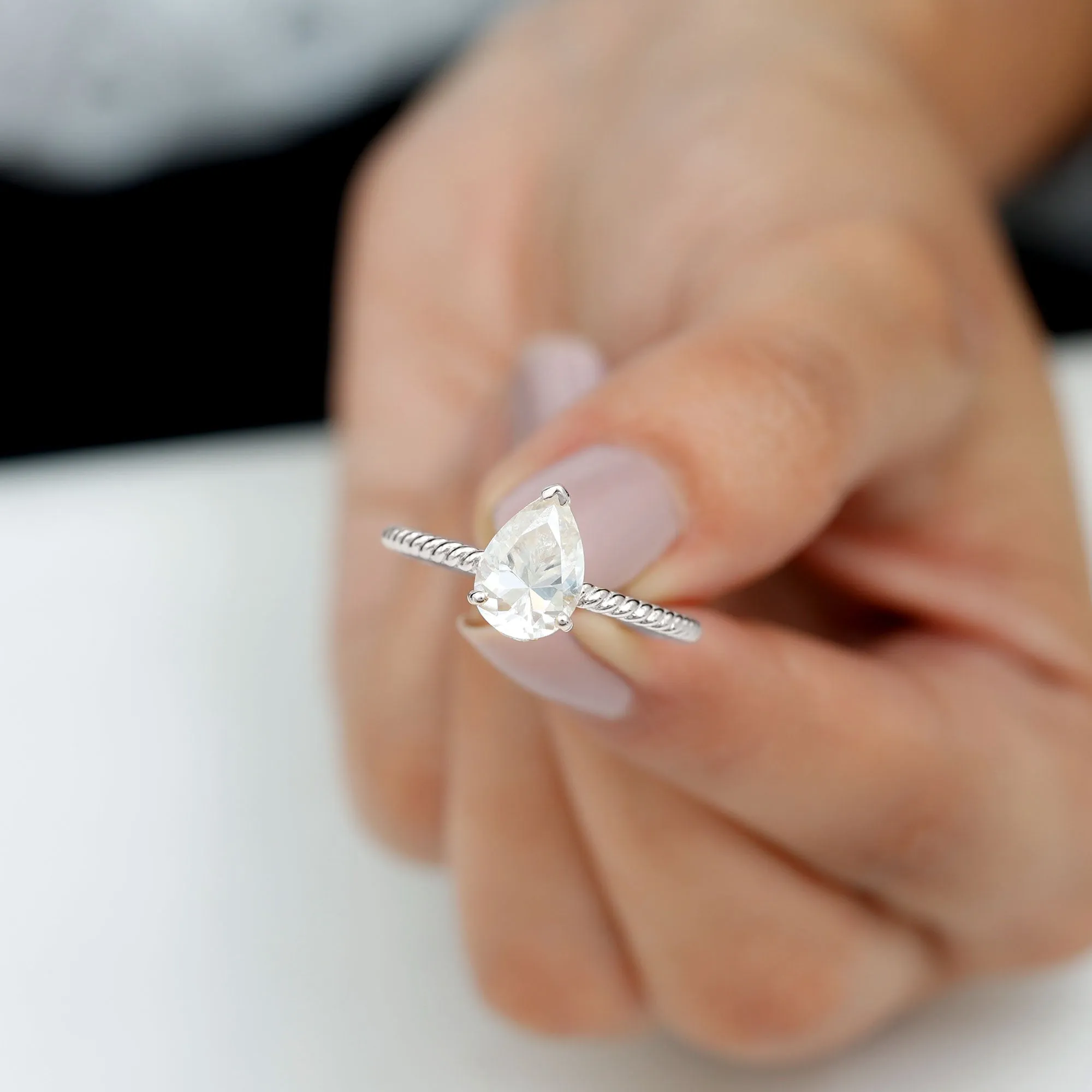 Pear Shaped Moissanite Solitaire Ring with Gold Twisted Rope