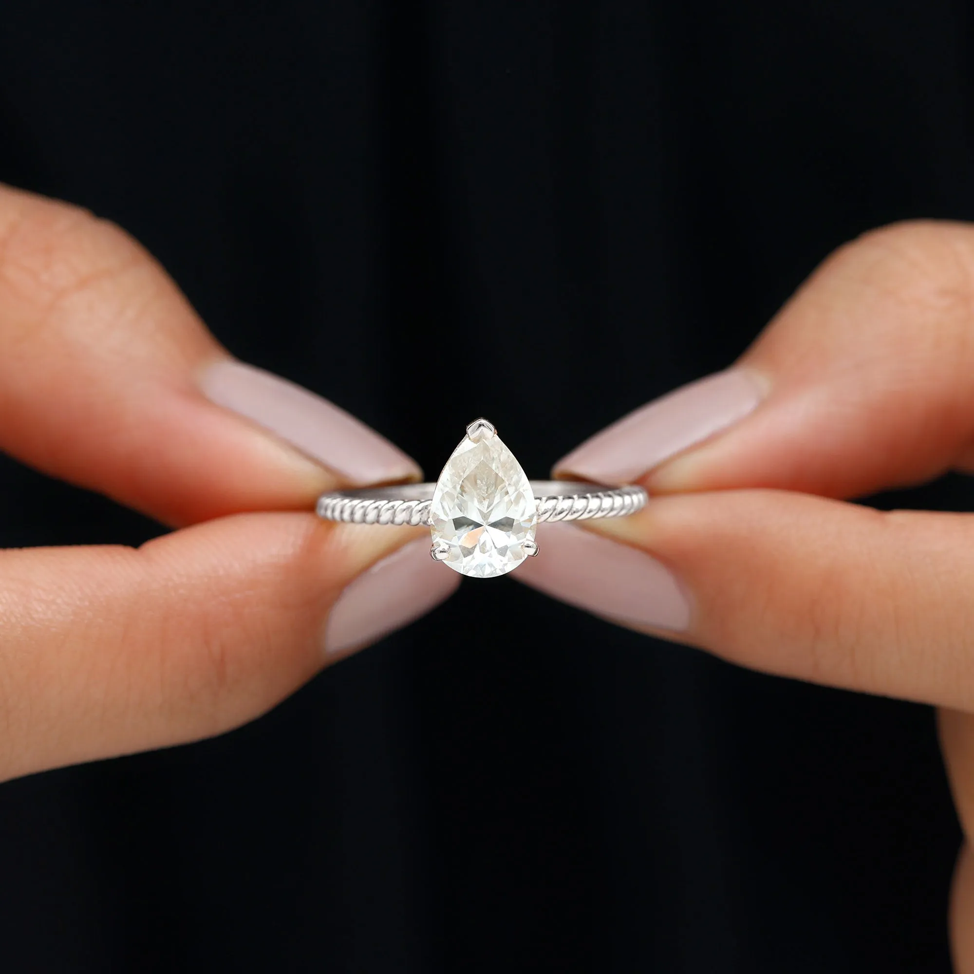 Pear Shaped Moissanite Solitaire Ring with Gold Twisted Rope